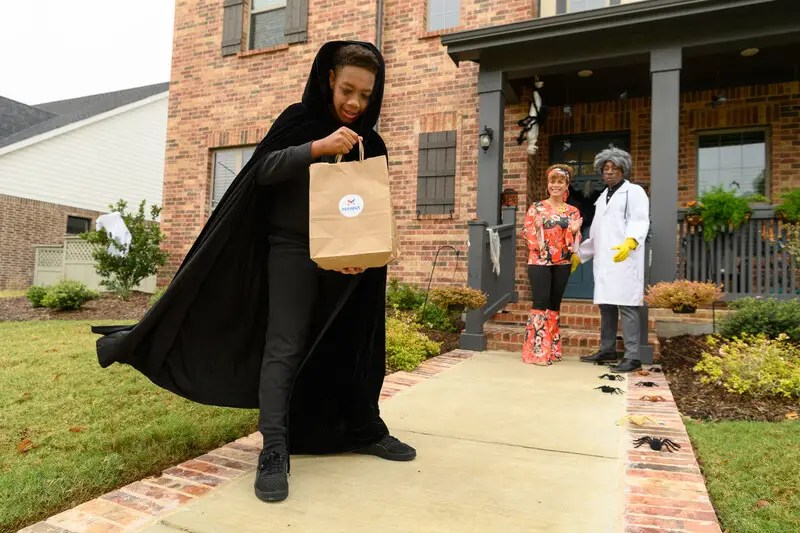 world first trick or treat takes to the skies with manna drone delivery